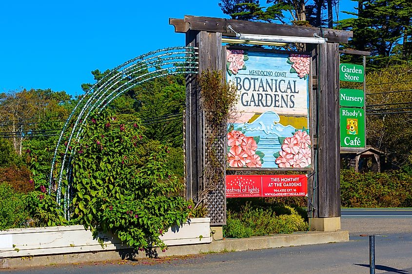 Mendocino Coast Botanical Gardens colorful sign and archway welcome visitors.